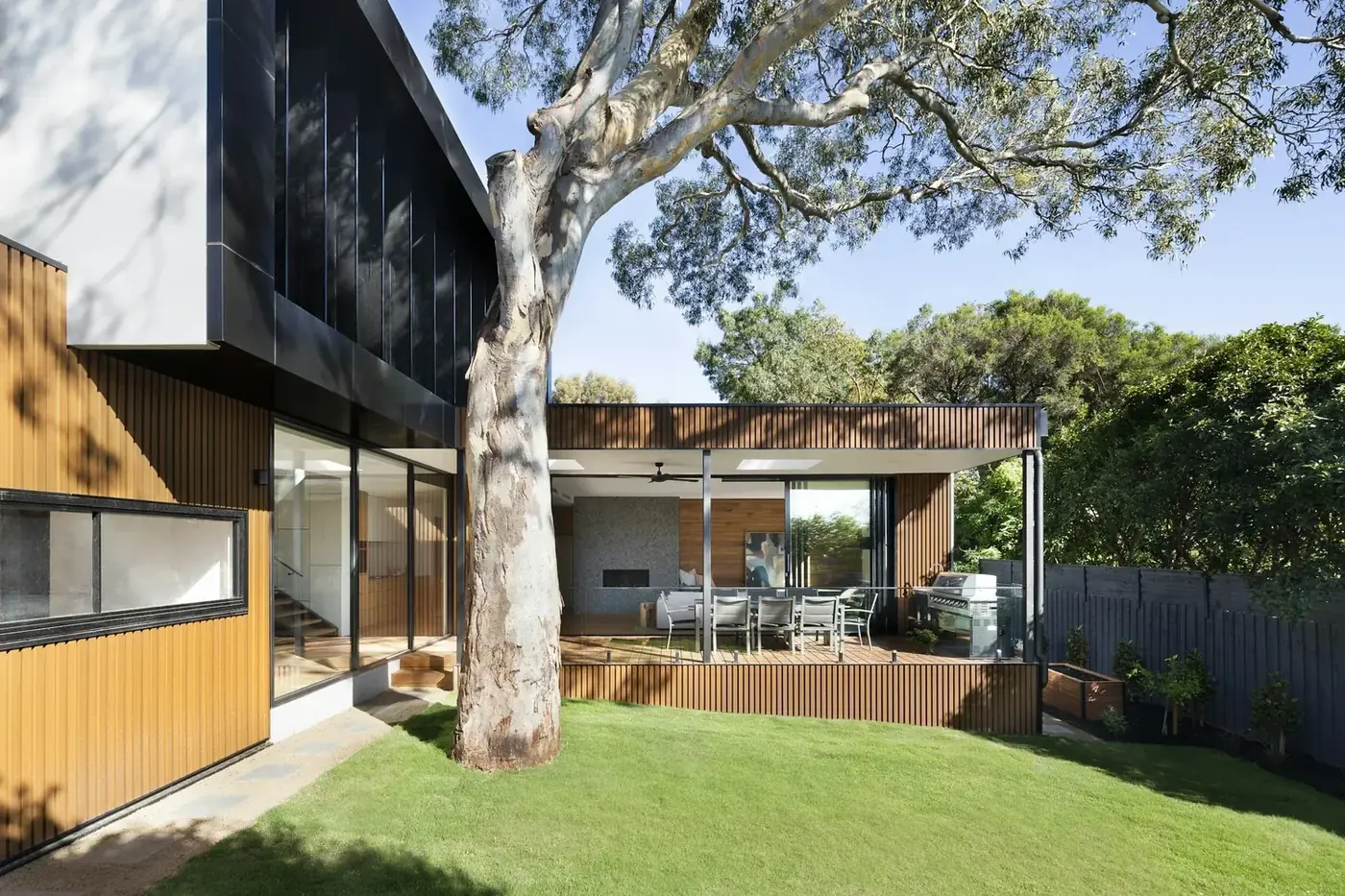Modern wooden and black metal house facade